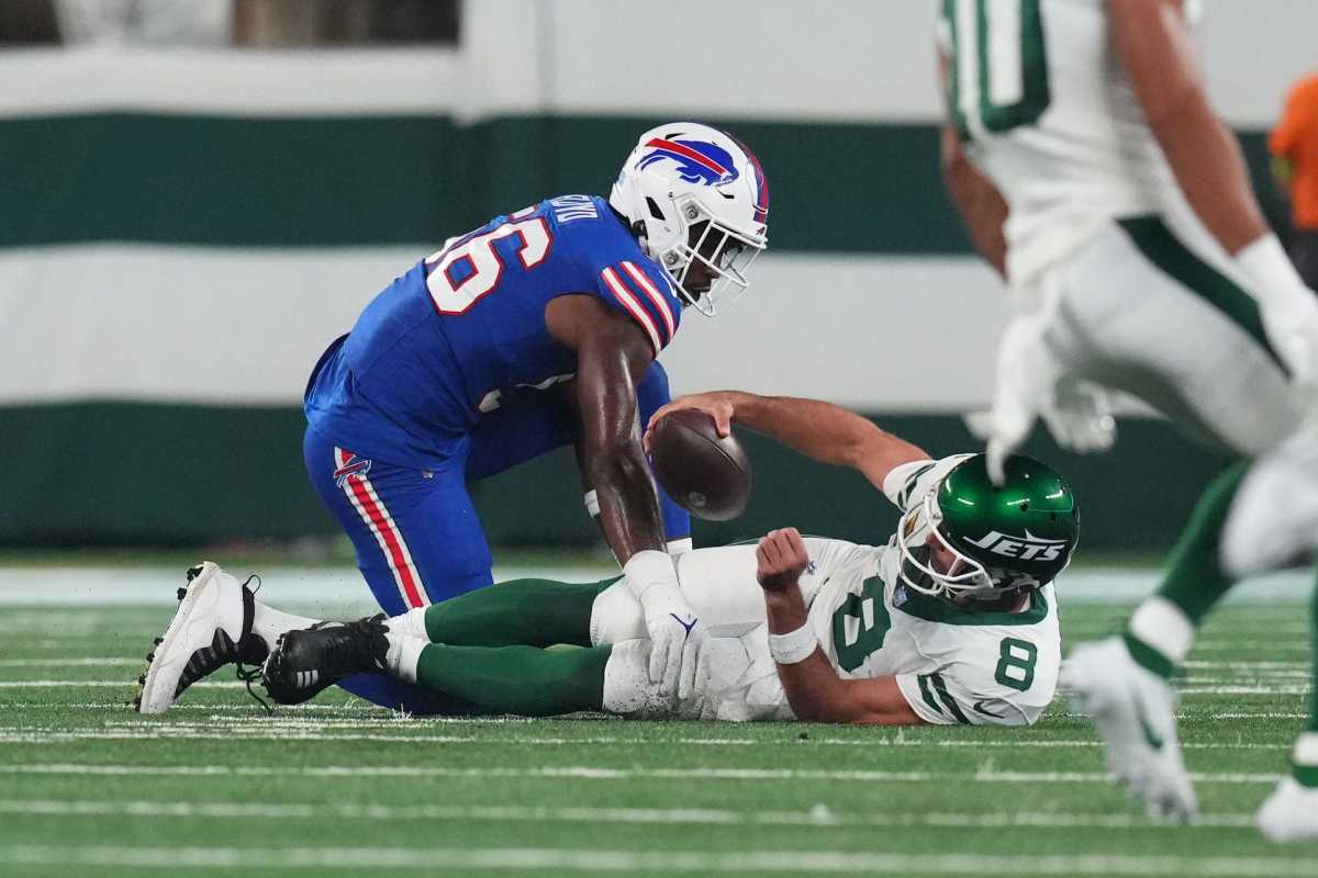 Jets' QB Aaron Rodgers (8) on the ground after being sacked by Leonard Floyd